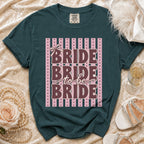 Dark teal Comfort Colors t-shirt with "Bride to be Bride" text and pink stripes.