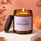 Amber candle with "Sienna, it's giving bridesmaid. say yes?" text.
