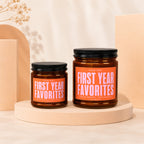 Two amber glass jars with black lids, labeled "First Year Favorites."