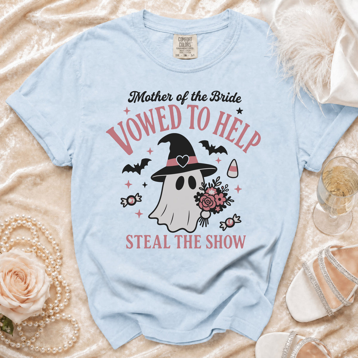 Light blue Comfort Colors t-shirt with "Mother of the Bride Vowed to Help Steal the Show" text and a ghost graphic.