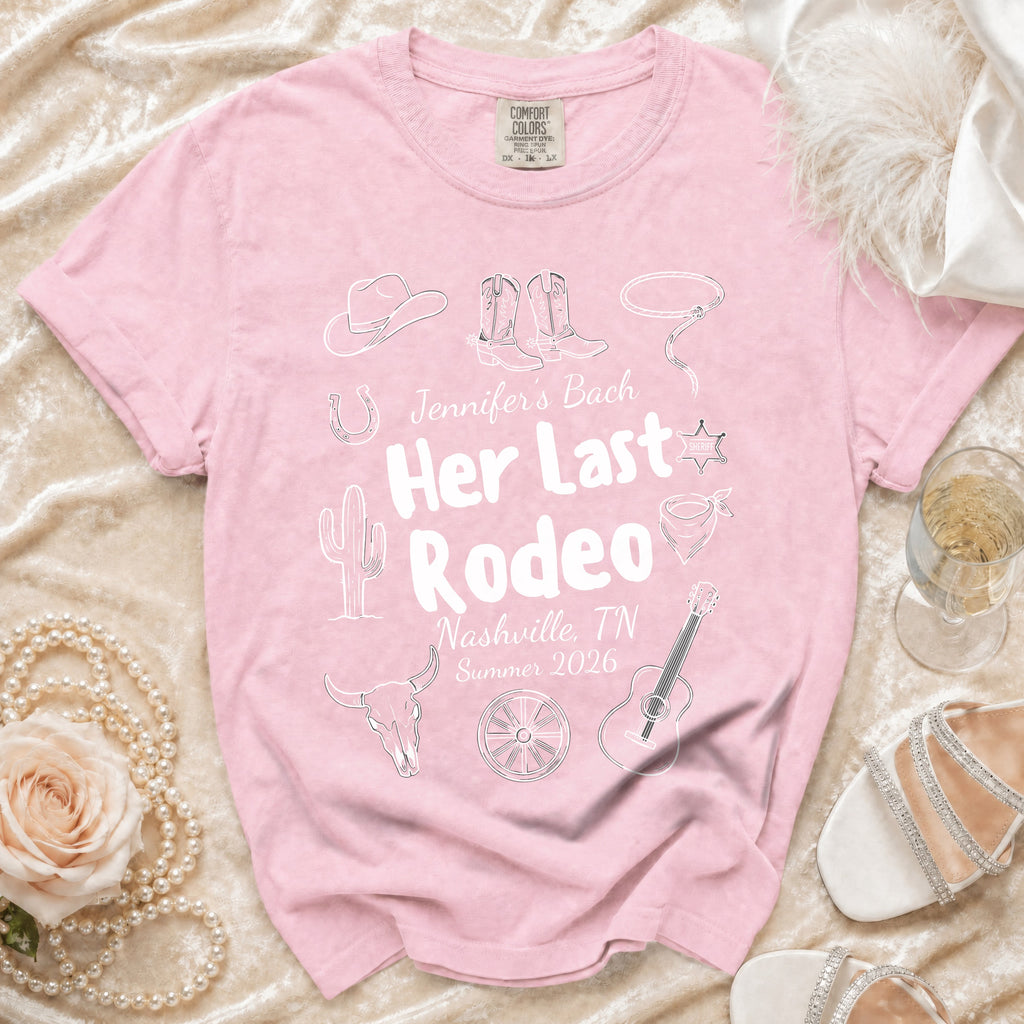 Pink t-shirt with "Jennifer's Bach Her Last Rodeo" text and rodeo graphics.