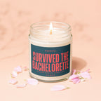 Candle with lit wick and label that reads "Survived the Bachelorette".
