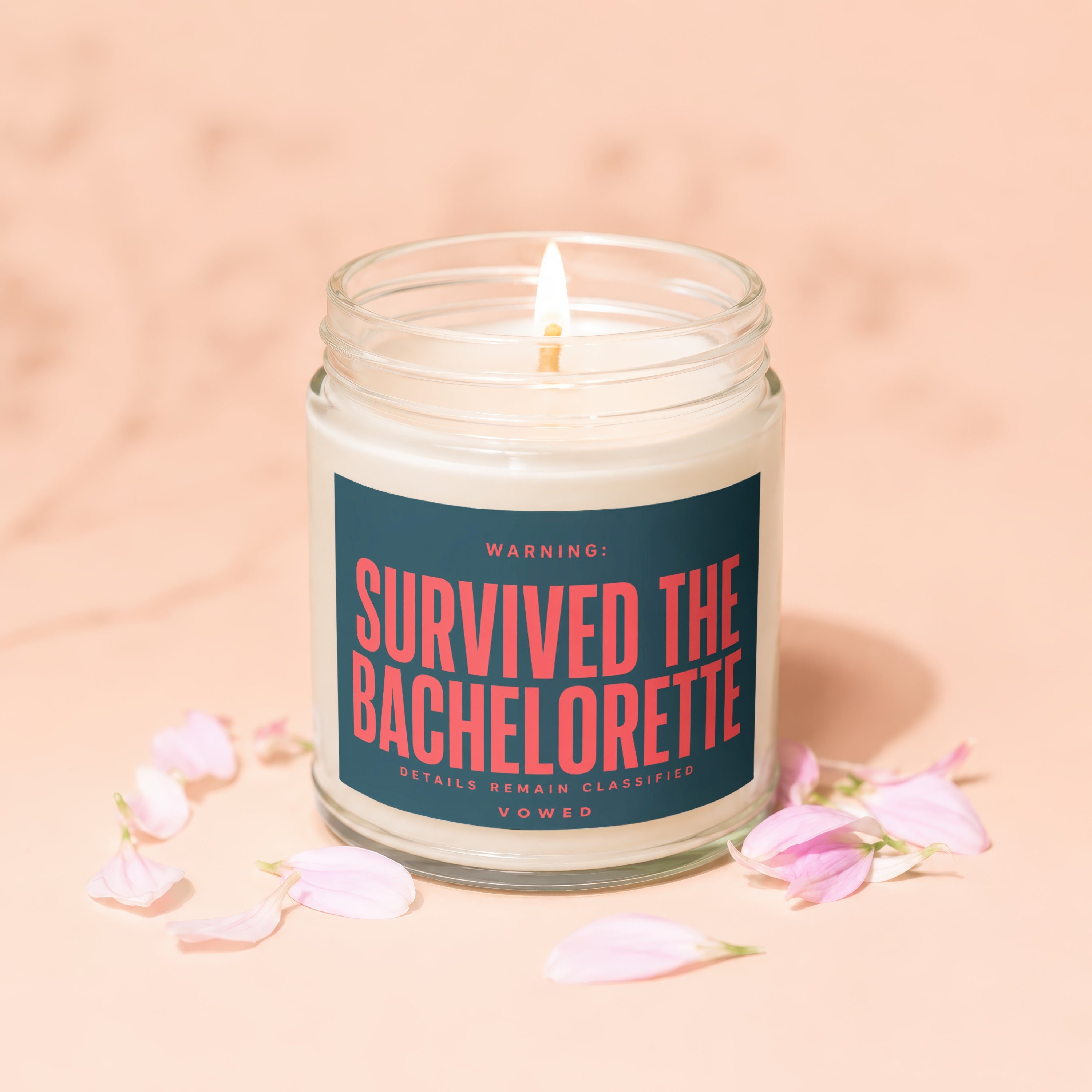 Candle with lit wick and label that reads "Survived the Bachelorette".