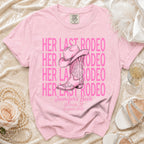 Pink t-shirt with "Her Last Rodeo" text and cowboy boot graphic.
