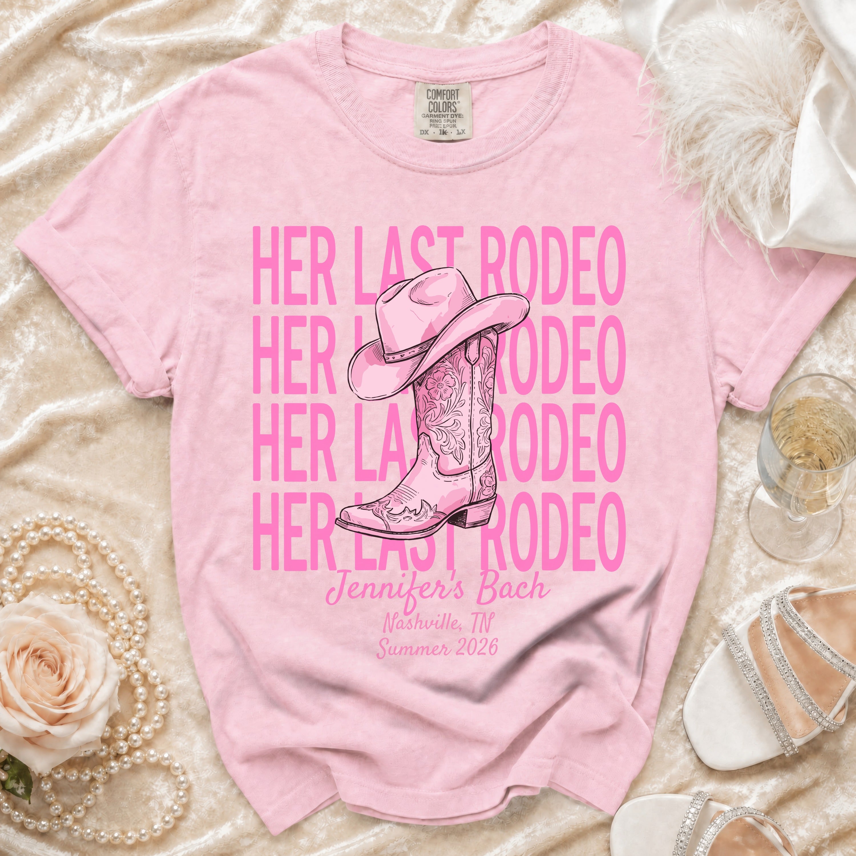 Pink t-shirt with "Her Last Rodeo" text and cowboy boot graphic.