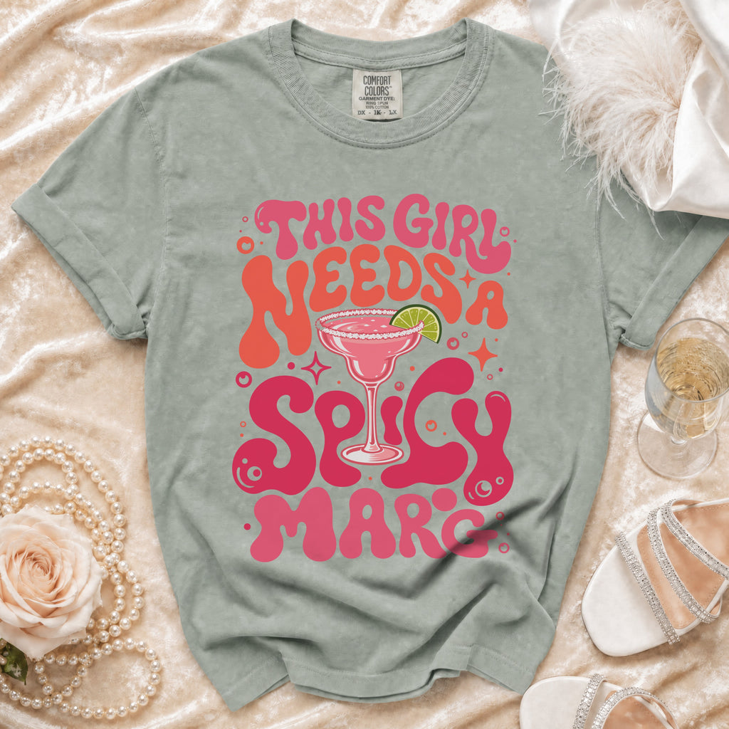 Green t-shirt with "This Girl Needs A Spicy Marc" graphic and margarita glass.