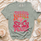 Green t-shirt with "This Girl Needs A Spicy Marc" graphic and margarita glass.