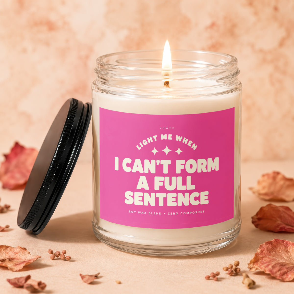 Soy wax candle with pink label reading "Light me when I can't form a full sentence."