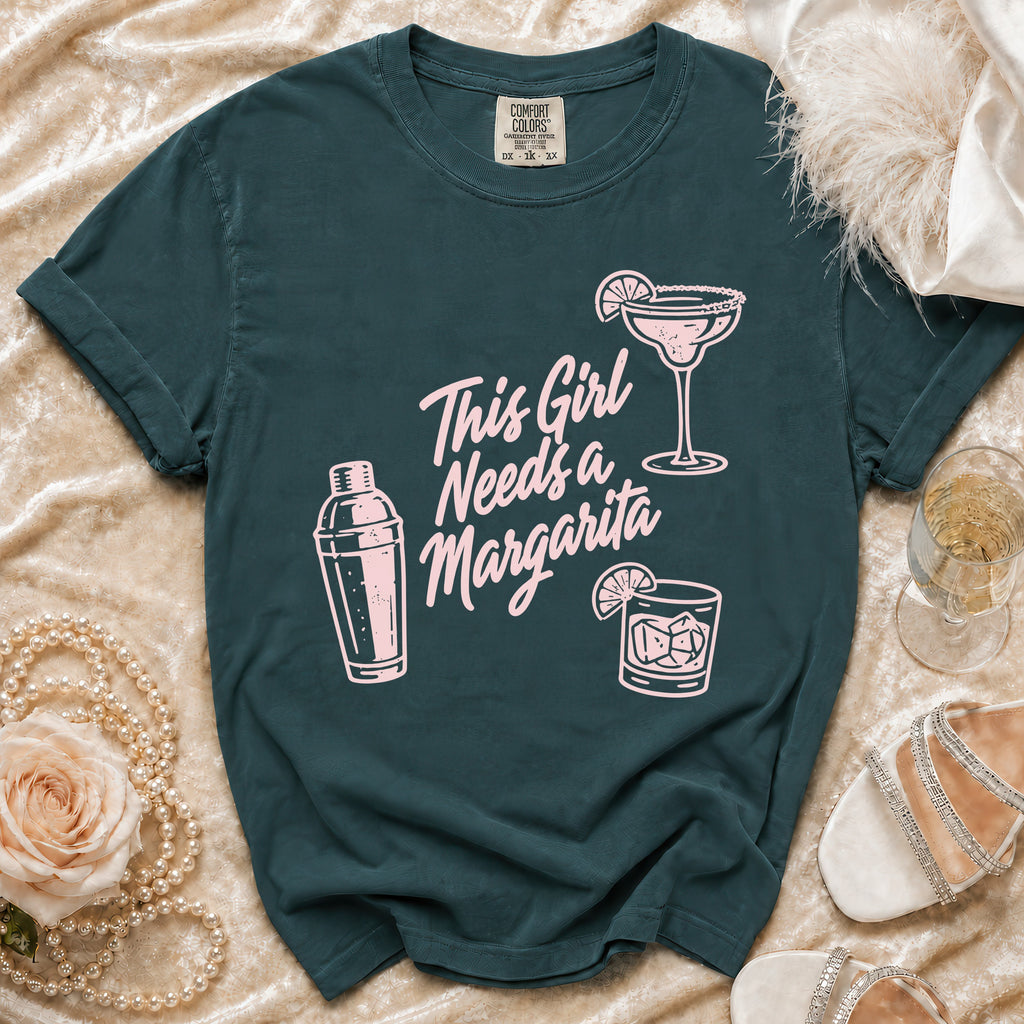 Dark teal t-shirt with pink graphic: "This Girl Needs a Margarita"