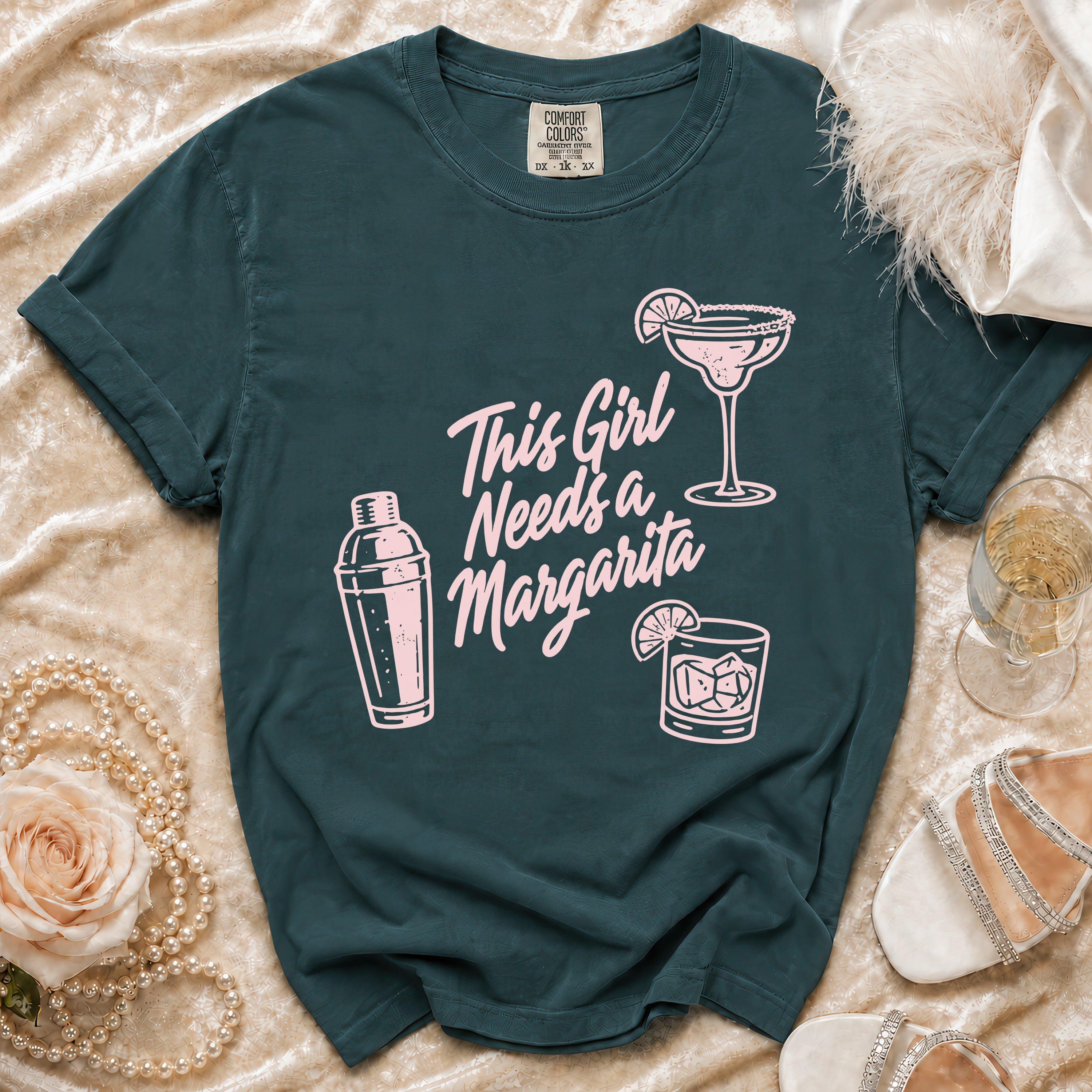 Dark teal t-shirt with pink graphic: "This Girl Needs a Margarita"