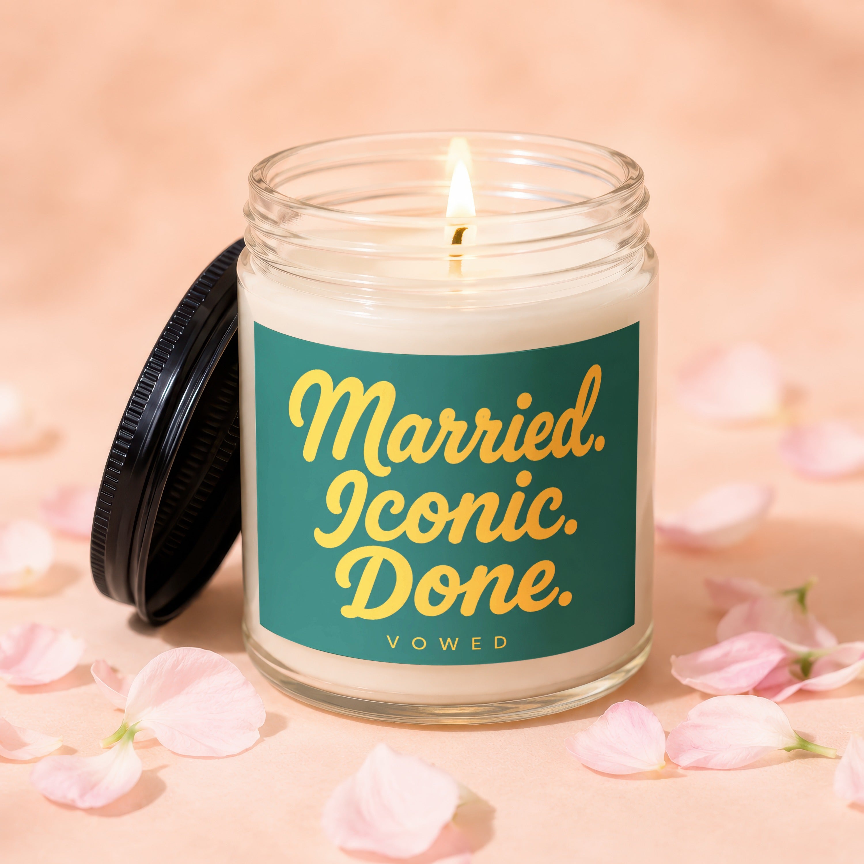 Jar candle with lit wick and "Married. Iconic. Done. VOWED." text.
