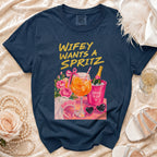 Navy t-shirt with "Wifey Wants a Spritz" graphic and bridal accessories.