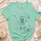 Mint t-shirt with "Til Death Do Us Party" text and Halloween-themed line drawings.