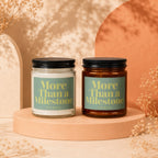 Two candles, one clear and one amber, labeled "More Than a Milestone VOWED".