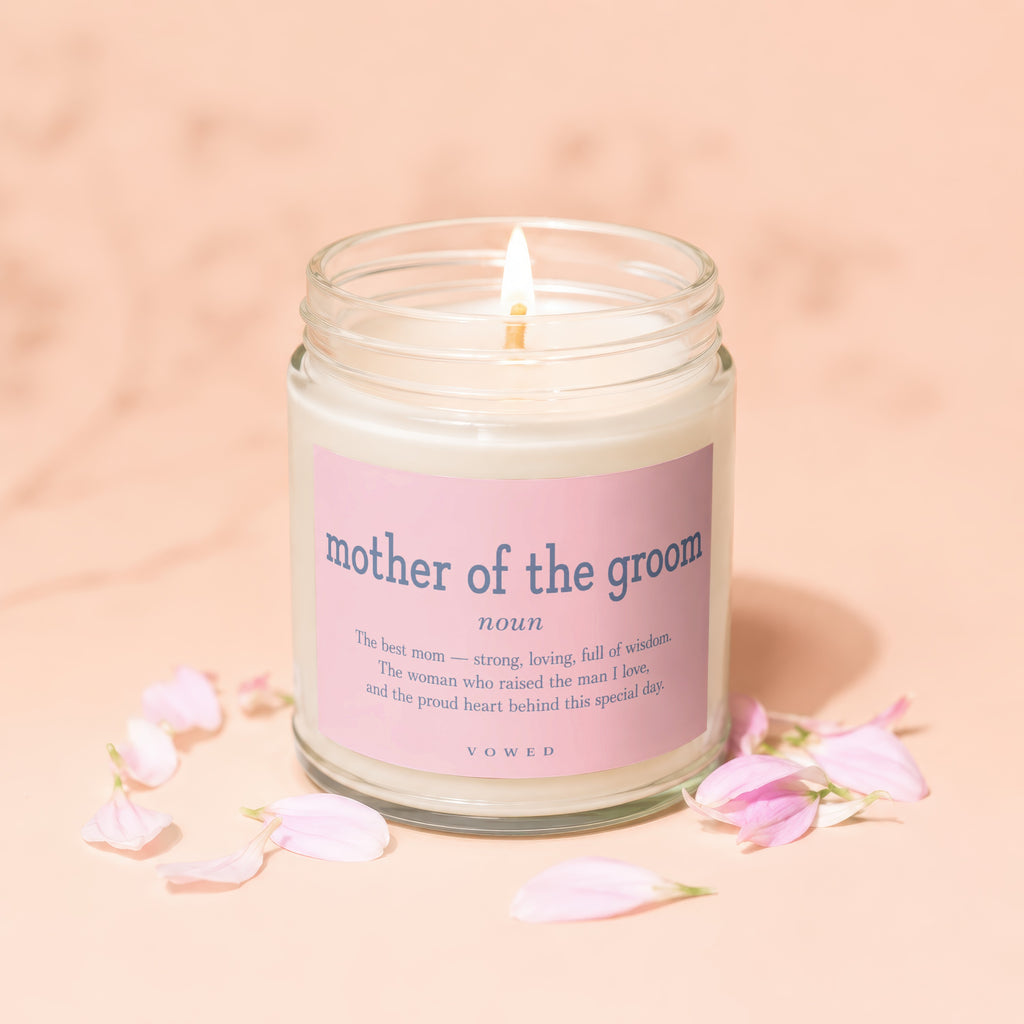 Candle with pink label reading "mother of the groom" and descriptive text from VOWED.