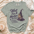 Green t-shirt with "Wait For A Mother of The Bride" and witch hat design.