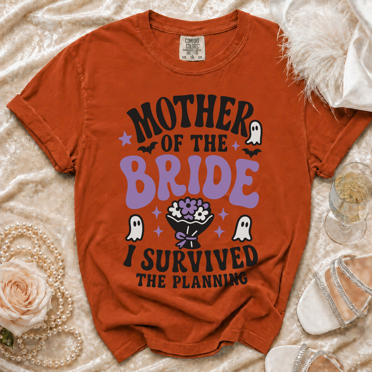 Orange t-shirt with "Mother of the Bride I Survived The Planning" text.