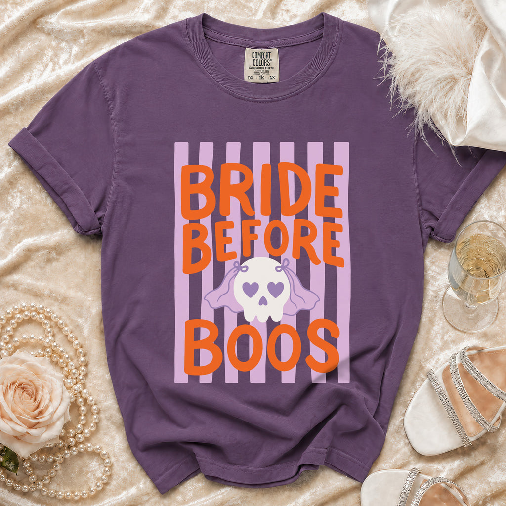 Purple t-shirt with "Bride Before Boos" text and a skull graphic.