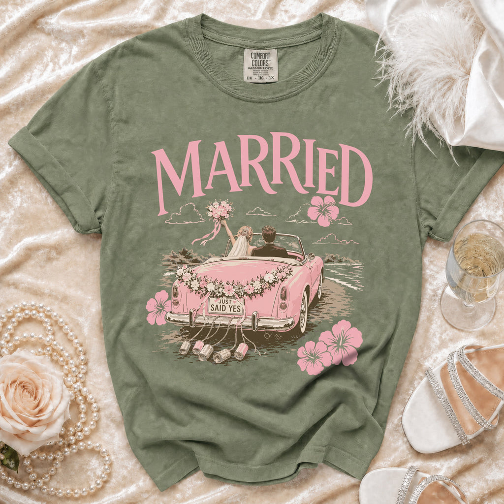 Green t-shirt with "MARRIED" and a pink graphic of a couple in a car.