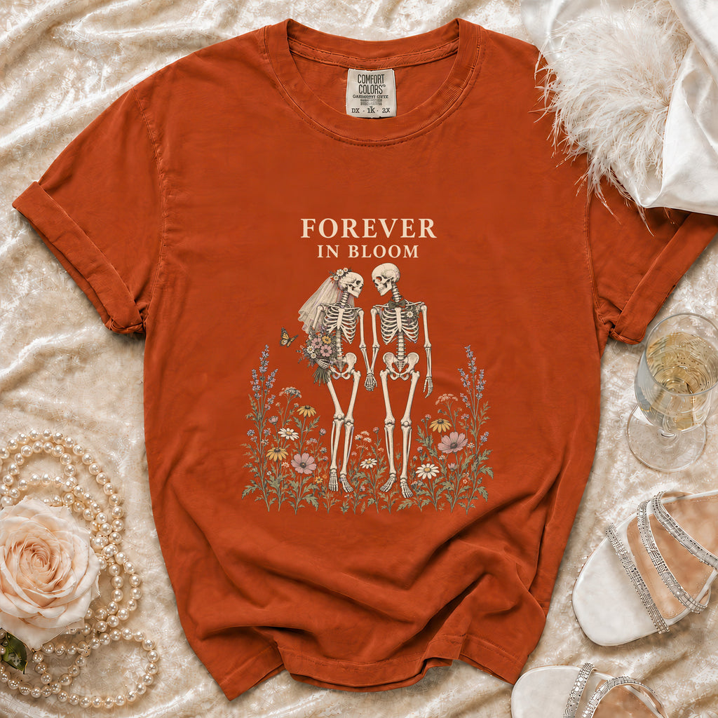 Orange t-shirt with skeleton bride and groom graphic and "Forever in Bloom" text.