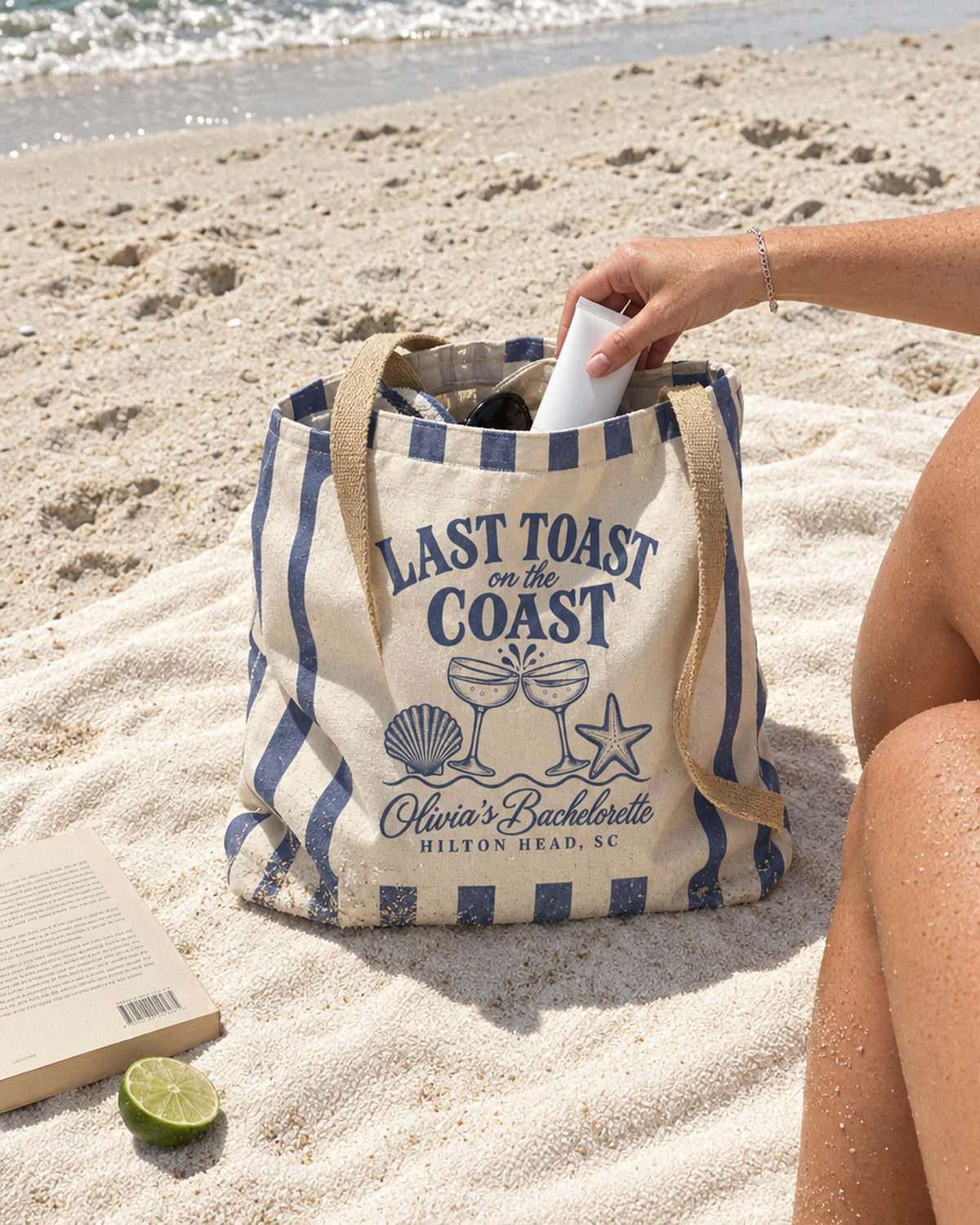 Blue Jean Last Toast On The Coast striped tote on a beach towel