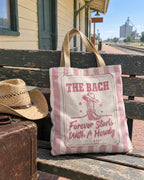 Forever Starts With A Howdy striped tote bag on a bachelorette trip with the crew