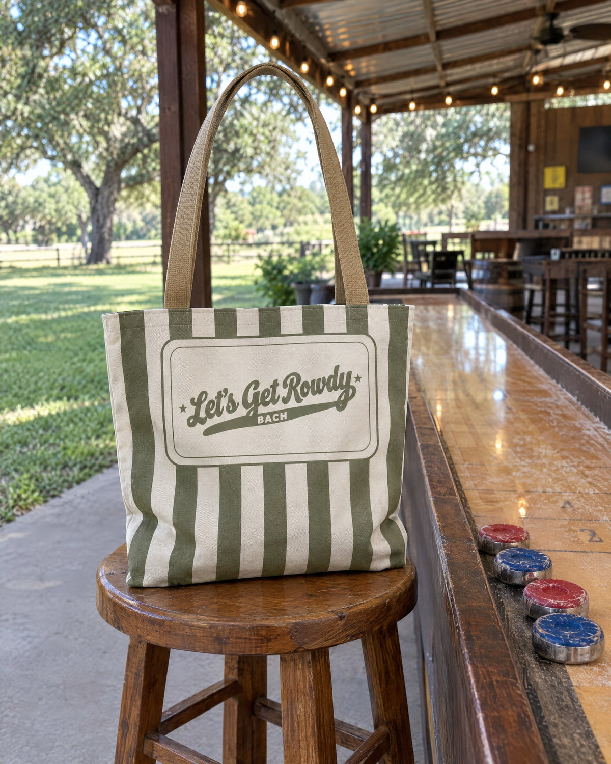 Let's Get Rowdy striped tote bag on a bachelorette trip with the crew
