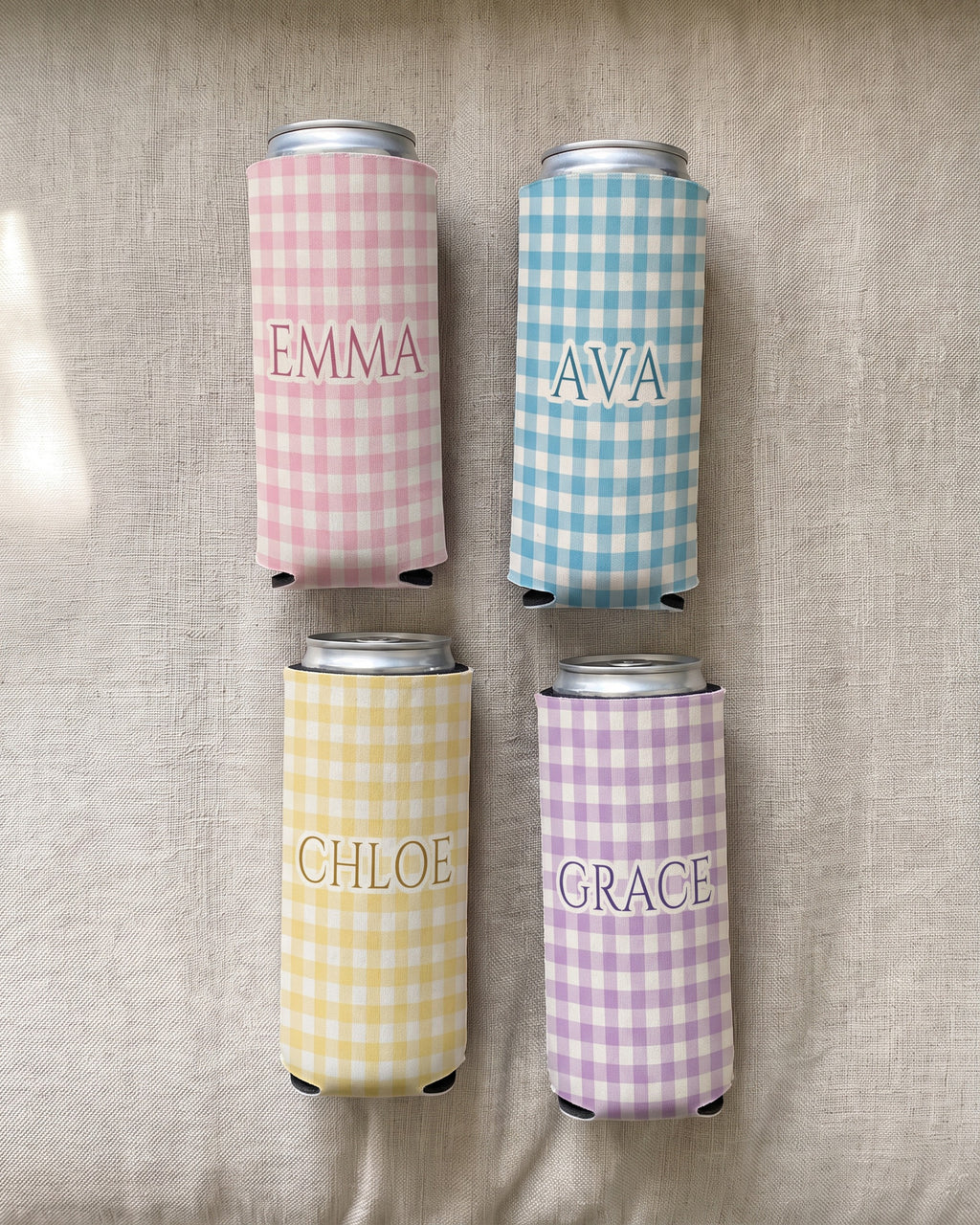 Four slim gingham name can coolers, each with a different name