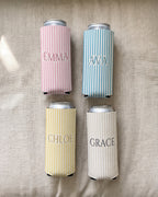 Four slim pinstripe name can coolers, each with a different name