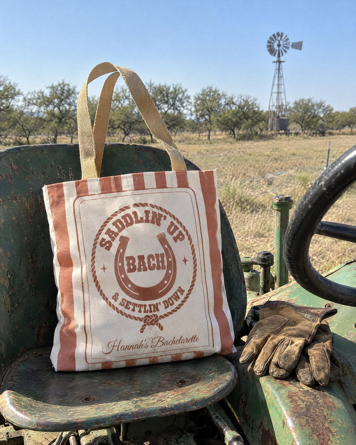 Saddlin' Up & Settlin' Down striped tote bag on a bachelorette trip with the crew
