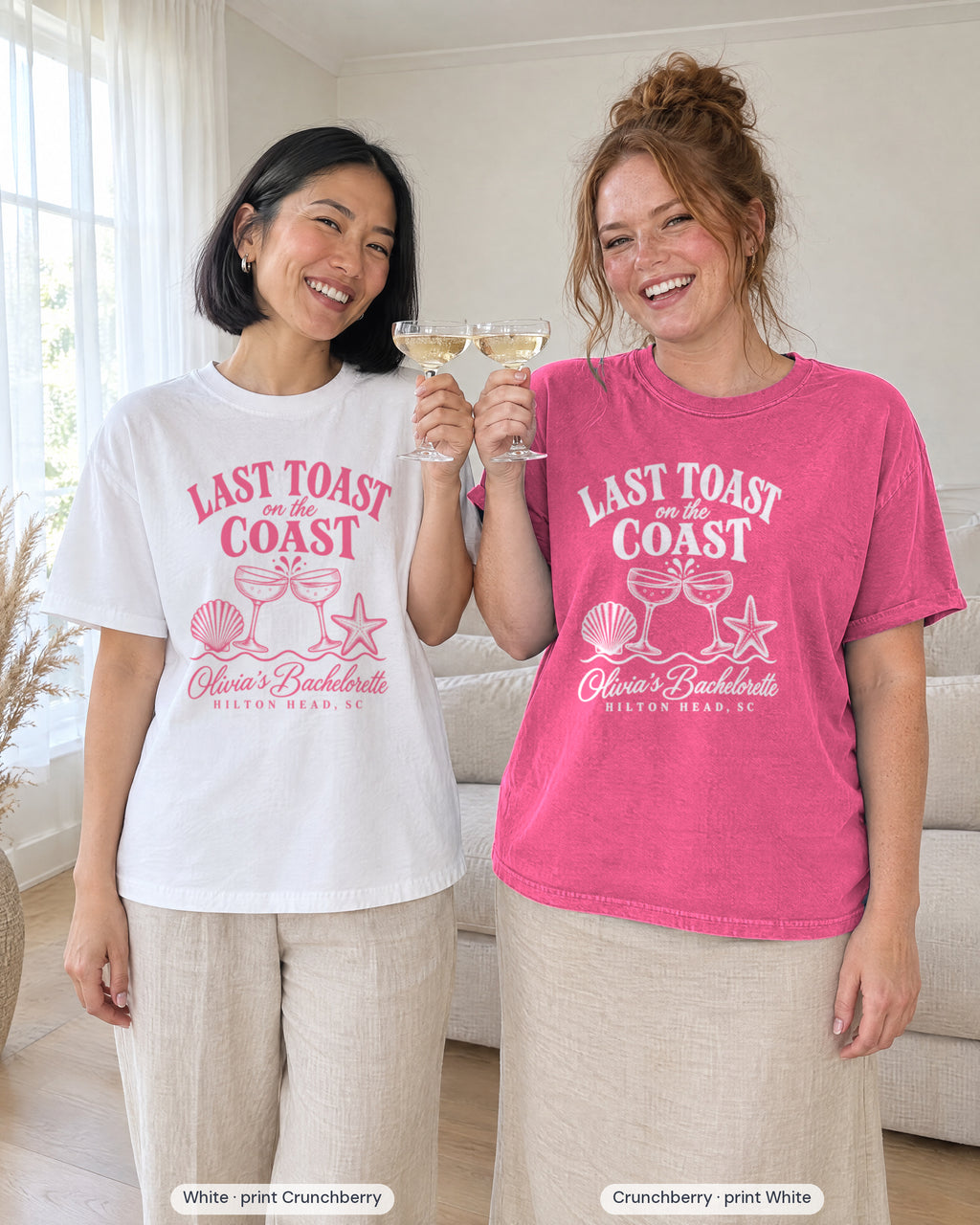Two friends toasting with coupes, bride in White printed in Crunchberry and crew in Crunchberry printed in white