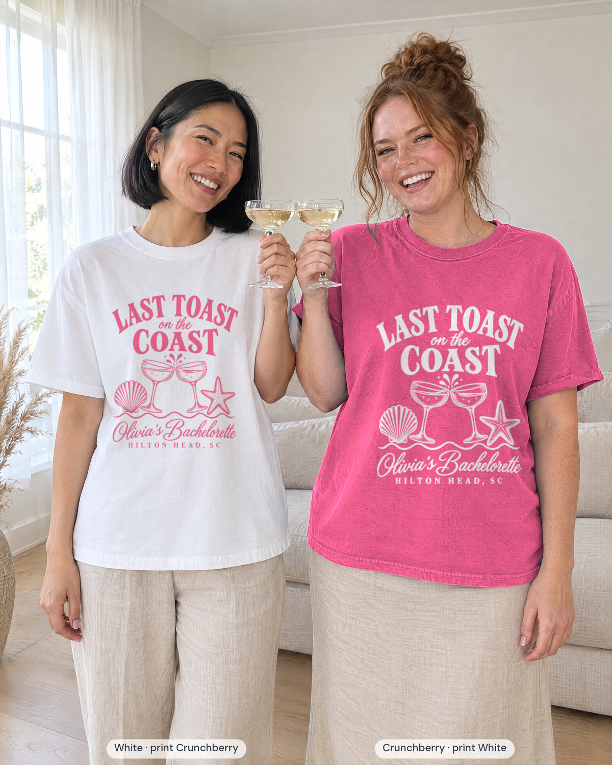 Two friends toasting with coupes, bride in White printed in Crunchberry and crew in Crunchberry printed in white