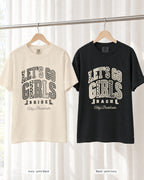 Ivory bride shirt printed in Black next to a Black crew shirt printed in ivory, Let's Go Girls tees