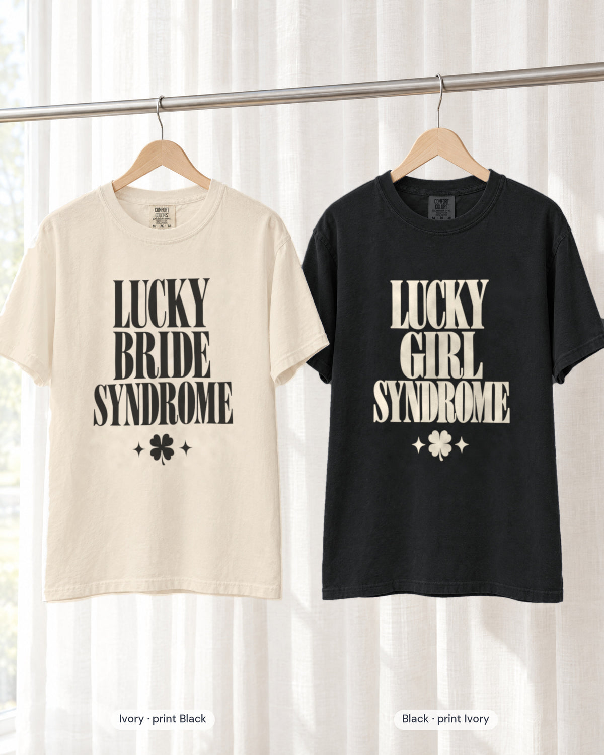 Ivory bride shirt printed in Black next to a Black crew shirt printed in ivory, Lucky Bride & Lucky Girl Syndrome tees