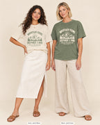 Ivory bride shirt printed in Moss next to a Moss crew shirt printed in ivory, Mountain Views Before I Dos tees