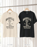 Ivory bride shirt printed in Black next to a Black crew shirt printed in ivory, Nashville Social Club tees