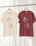 Ivory bride shirt printed in Chili next to a Chili crew shirt printed in ivory, Wild Wild Wife & Wild Wild Crew tees