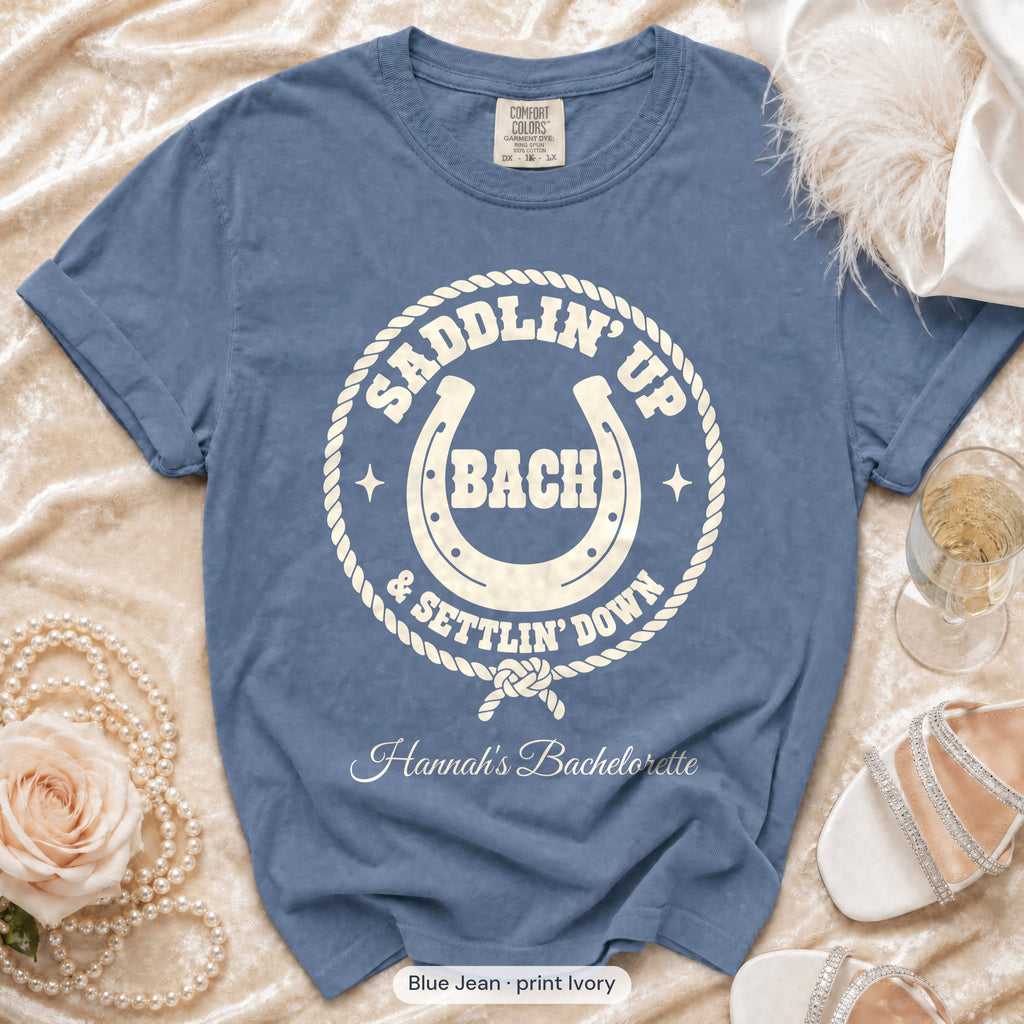 Blue Jean Saddlin' Up & Settlin' Down bachelorette crew t-shirt, print in ivory