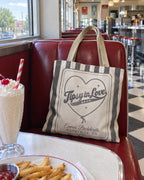 Tipsy In Love striped tote bag on a bachelorette trip with the crew