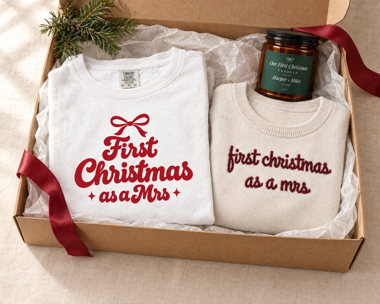First Christmas as a Mrs tee, knit sweater and engagement candle in an open gift box
